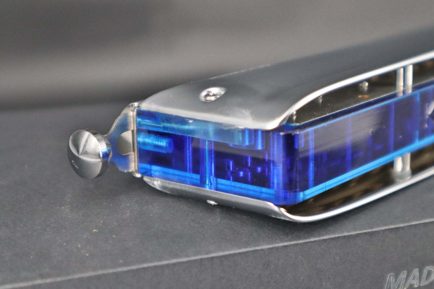 Close-up of the mechanism of the Lyra 16-Hole Chromatic Harmonica