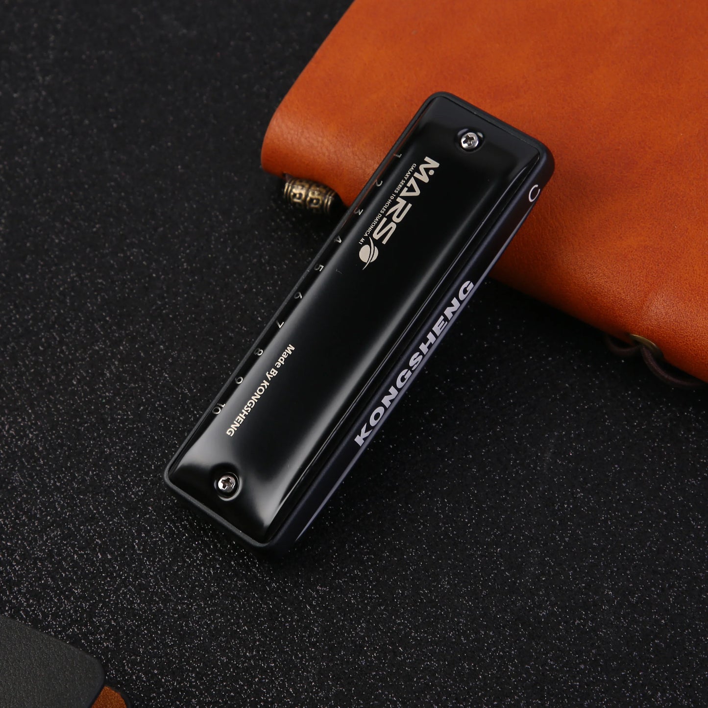 KONGSHENG MarsM2 diatonic harmonica in black color on leather background