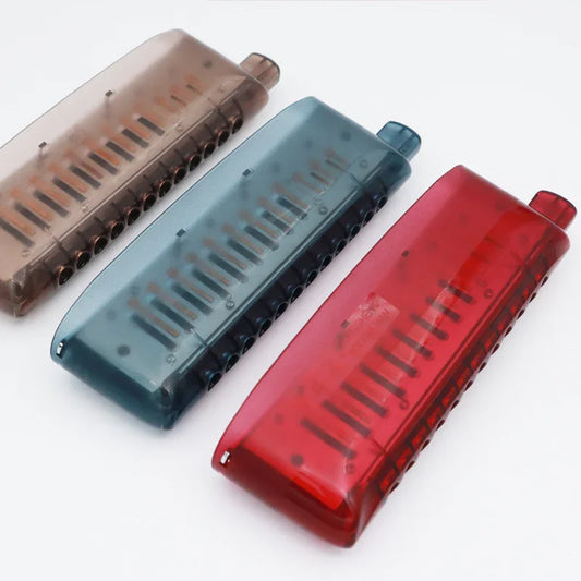Three colorful harmonicas in red, blue, and brown for beginners and pros